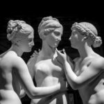 Milan, Italy - June 2020: Bertel Thorvaldsen’s statue The Three Graces. Neoclassical sculpture, in marble, of the mythological three charites.